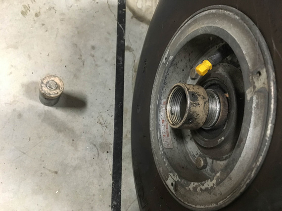 The axle nut comes off with finger pressure