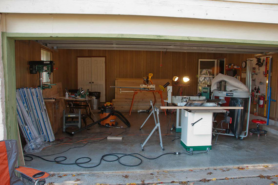 Setting up lighting. All that wood is for the benches.