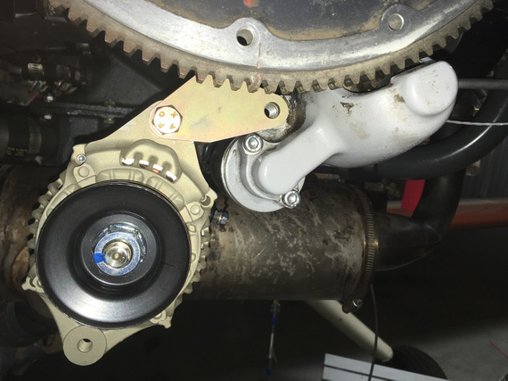 Alternator mount ear and starter